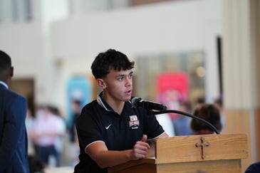BC High student speaks at a podium.