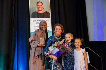 President GRace Cotter Regan receiving 2026 NEWLA Award